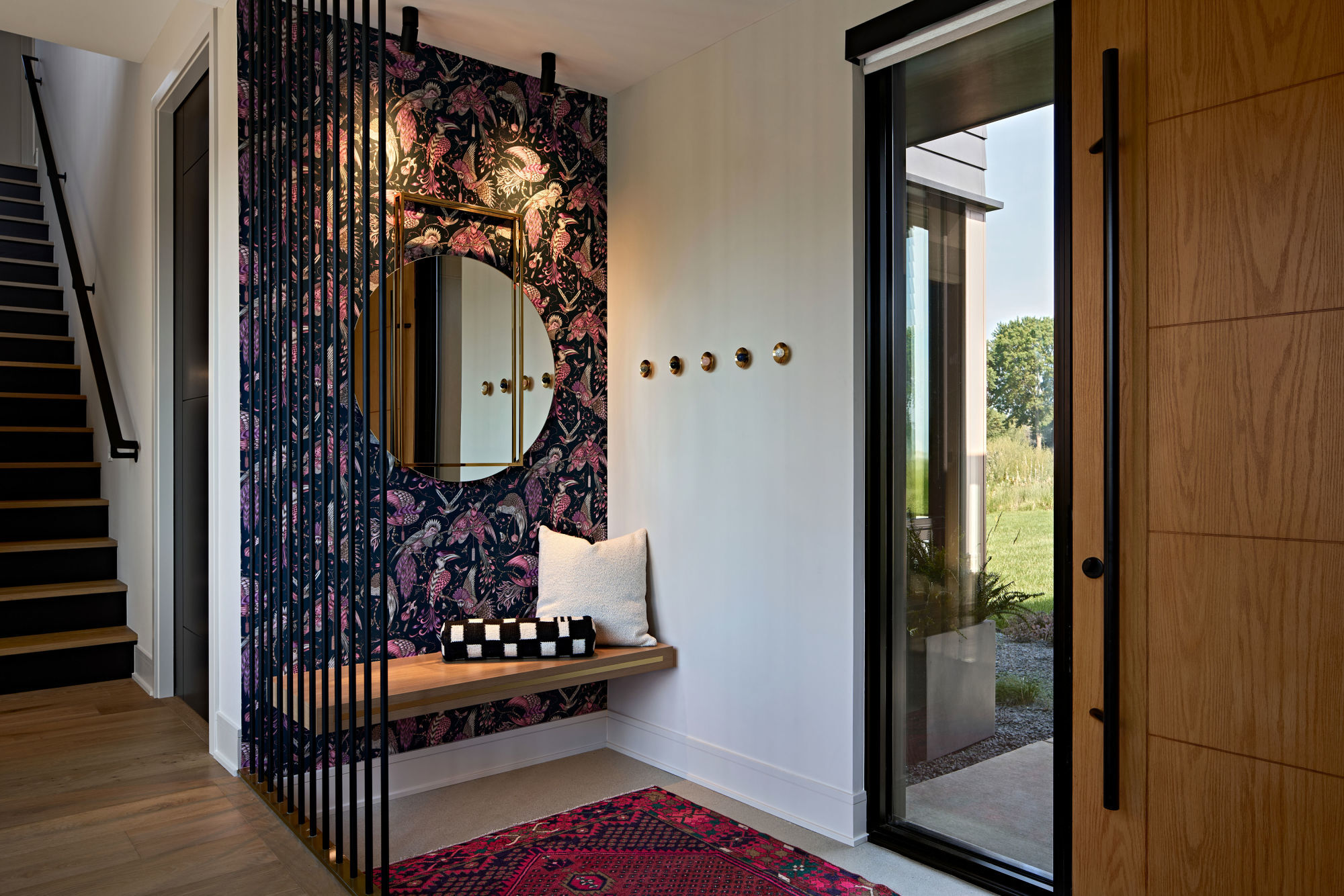 Entryway with bold wallpaper design