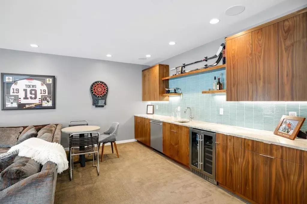 Adjoining wet bar and wine cellar