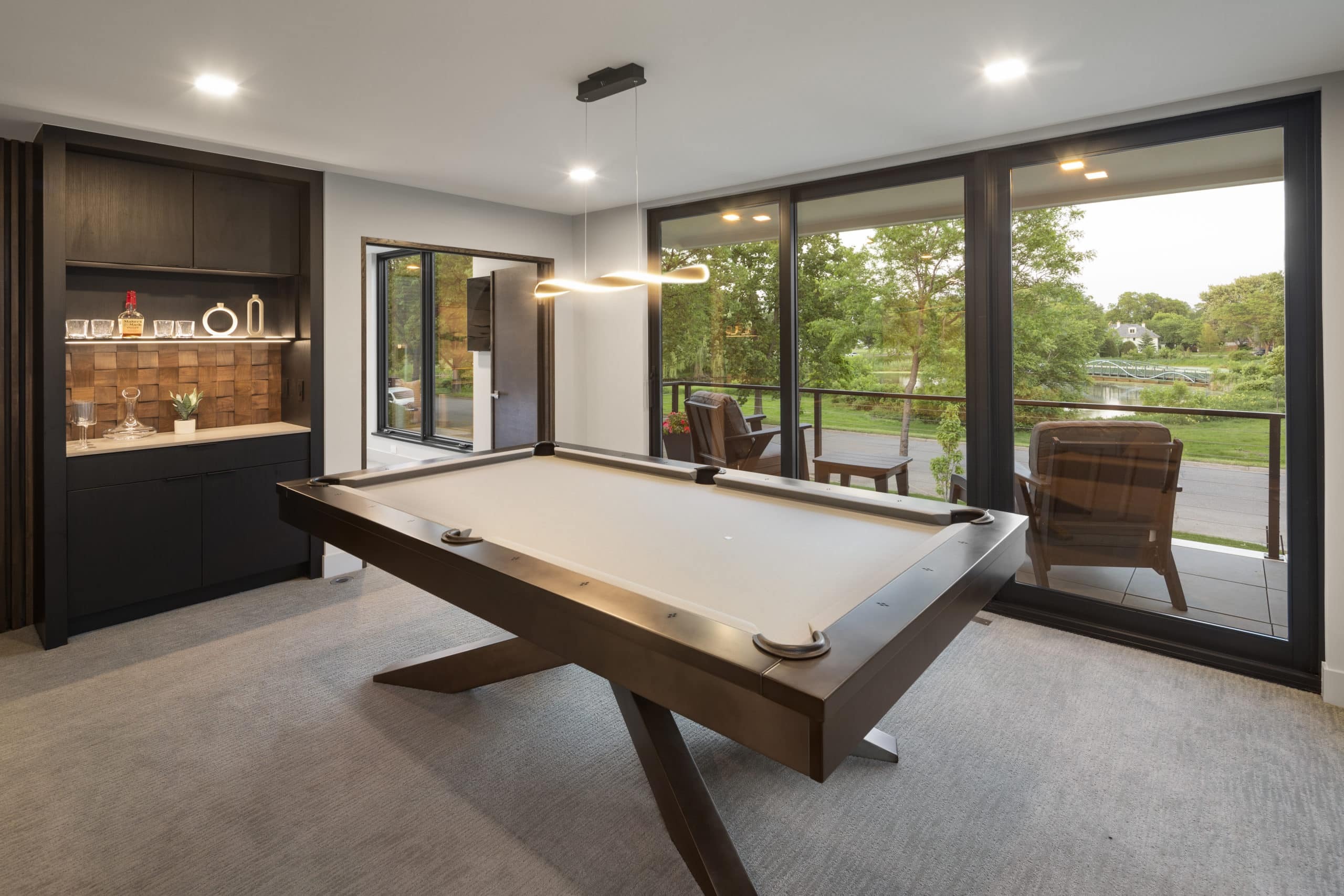 Second level with a snack bar and pool table