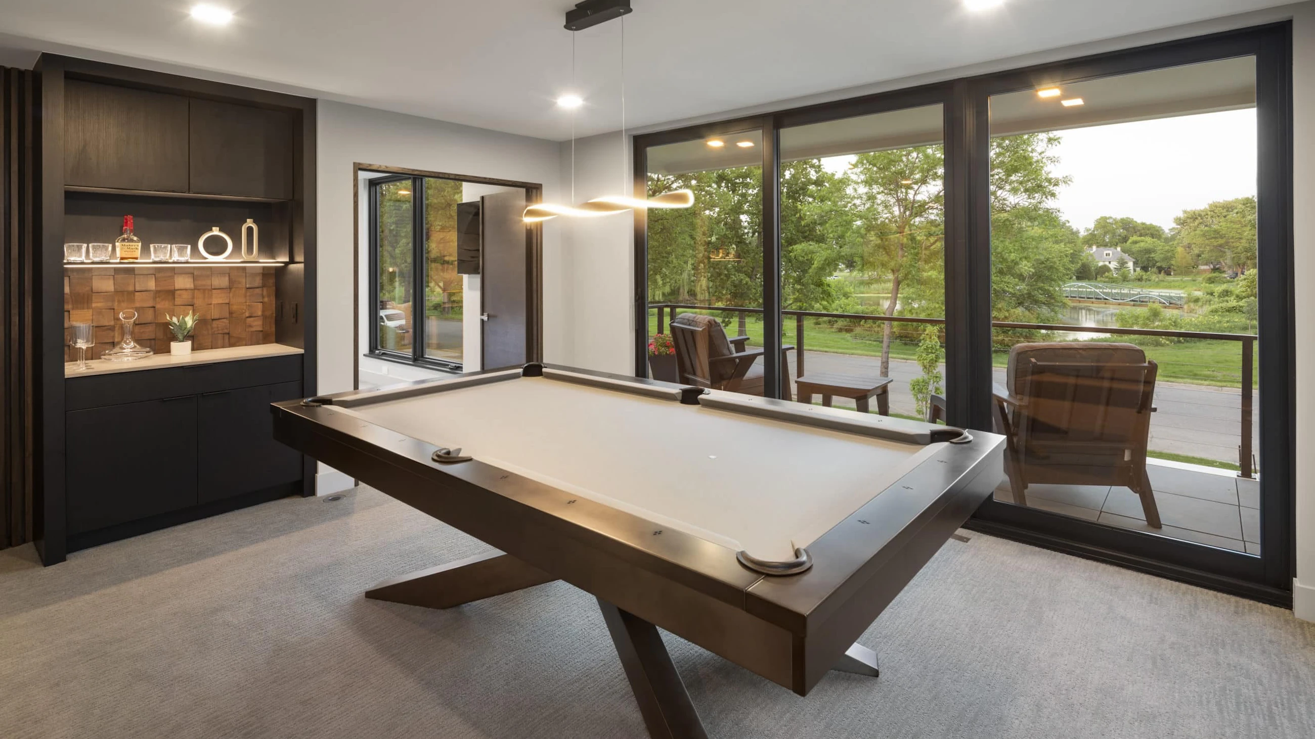 Second level with a snack bar and pool table