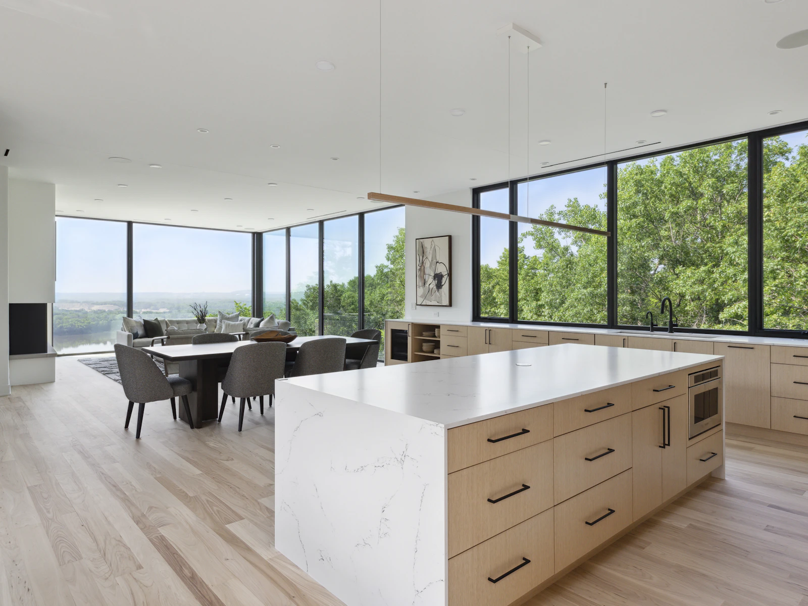 Open kitchen, dining, and living room with views all around