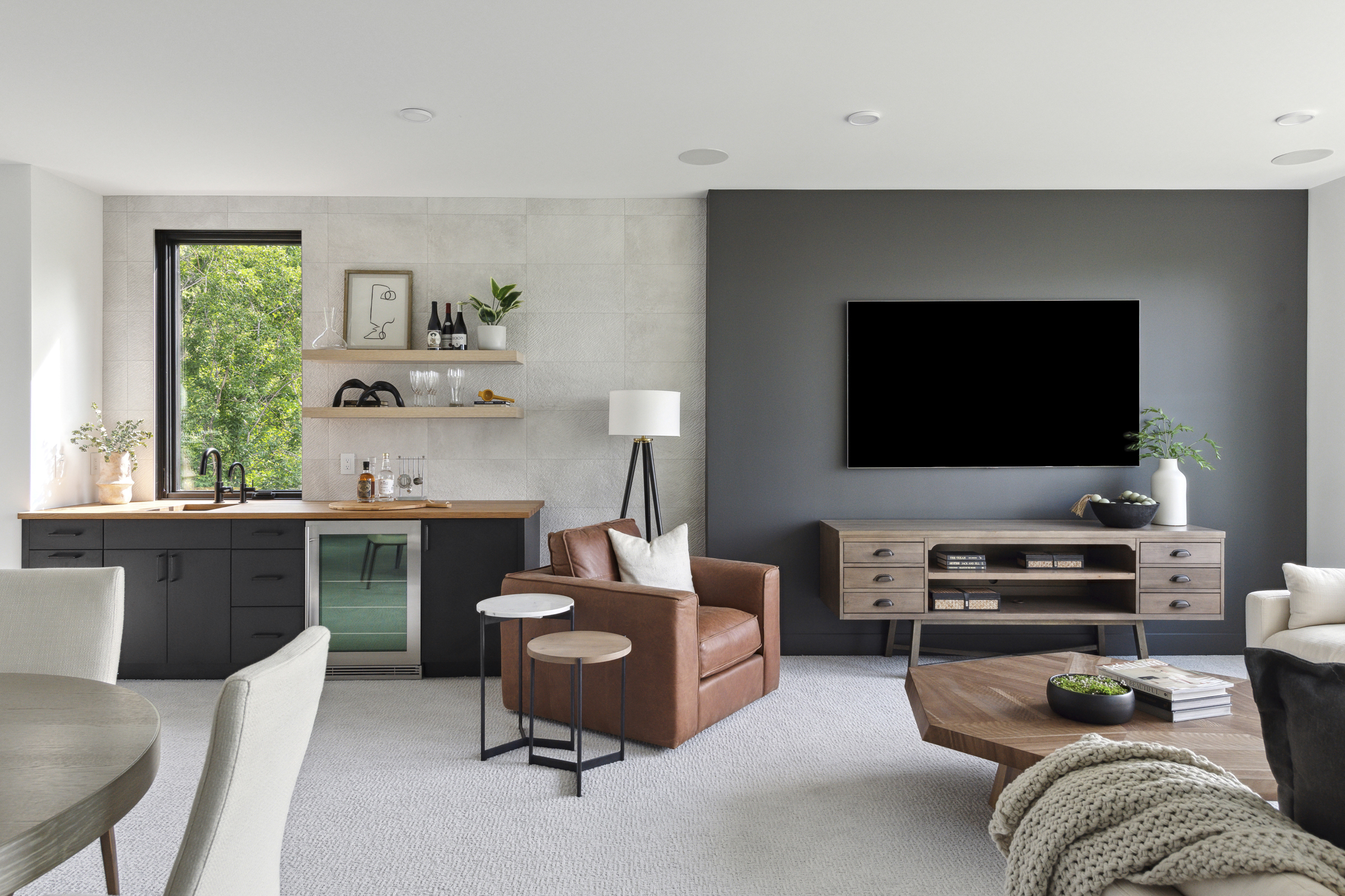Lower-level entertainment room with wet bar