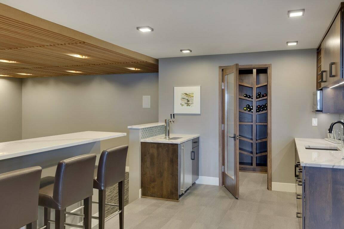 Basement with custom slatted ceiling